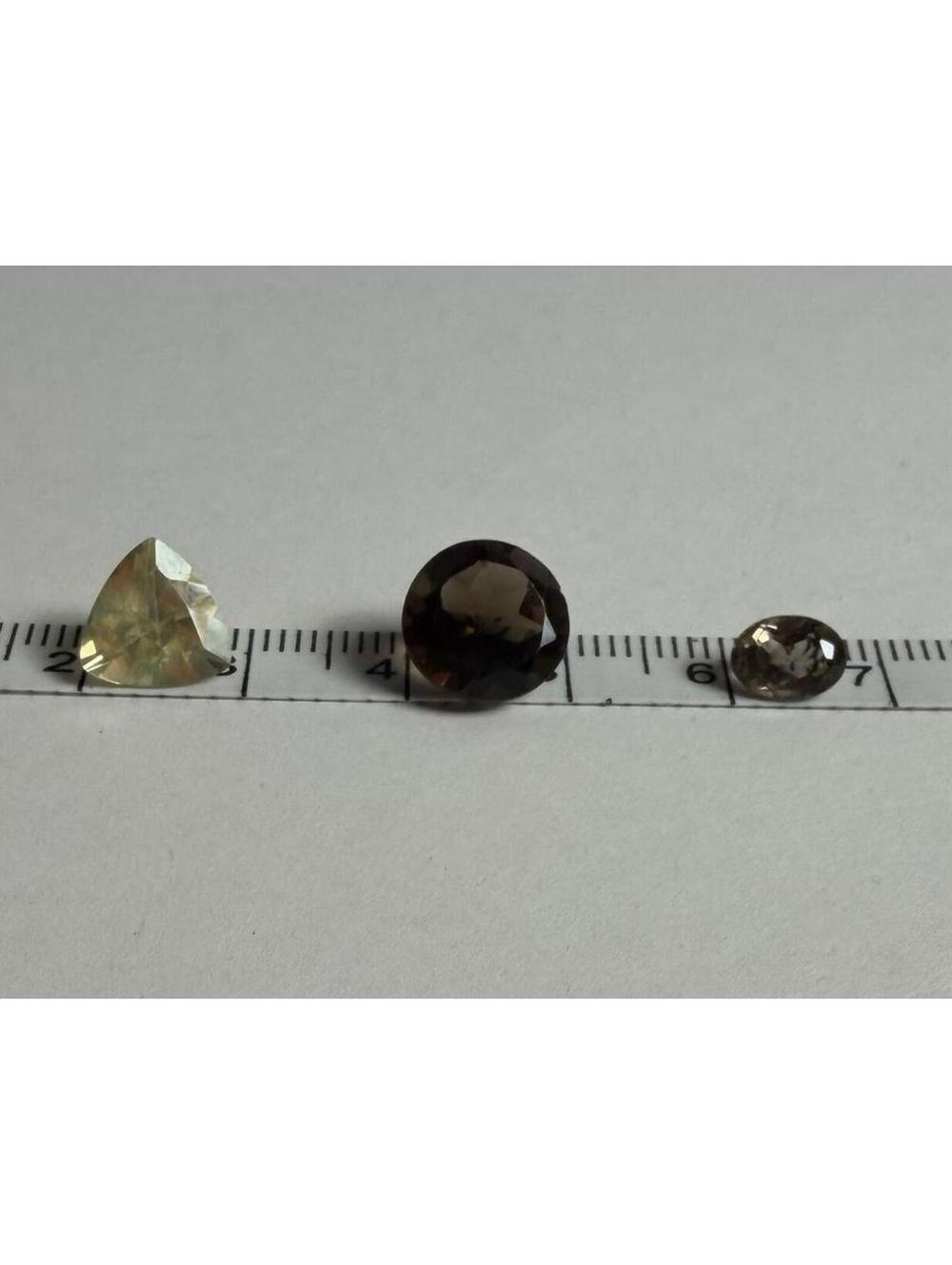 GEMS Set of 3 Faceted 2 are smokey quartz and 1 is a yellow trilliant cut quartz